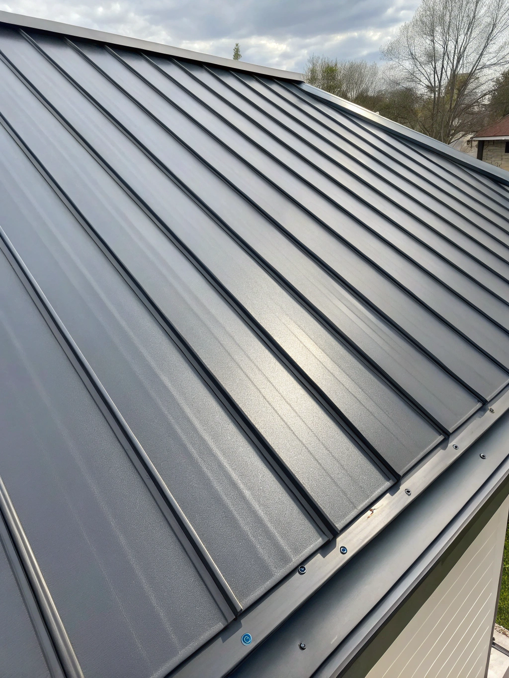 Modern standing seam metal roof on a premium residence