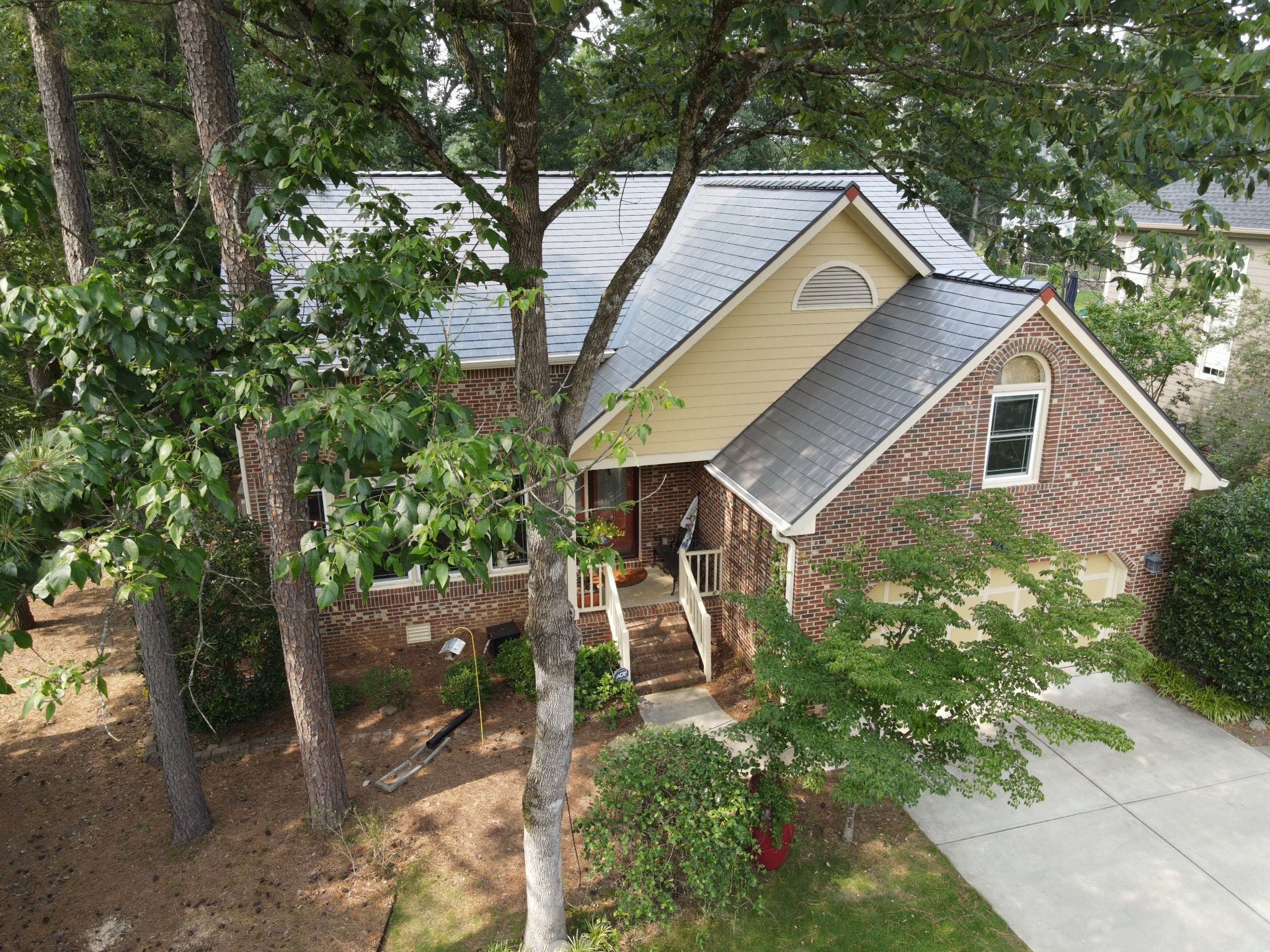 Completed Interlock slate-style aluminum roof on a North Carolina home