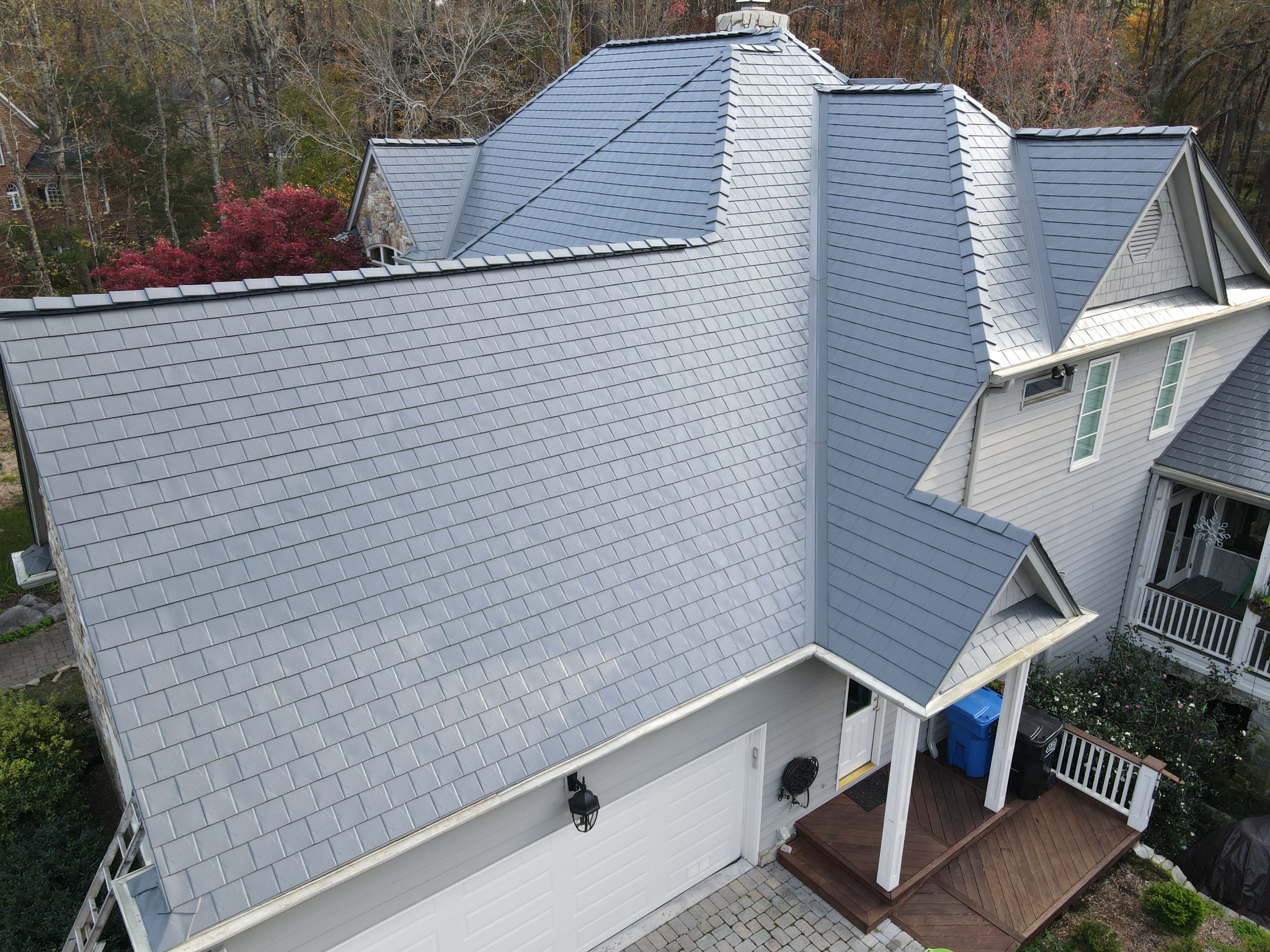 Aerial view of completed Interlock aluminum roof with valleys, hips and dormers