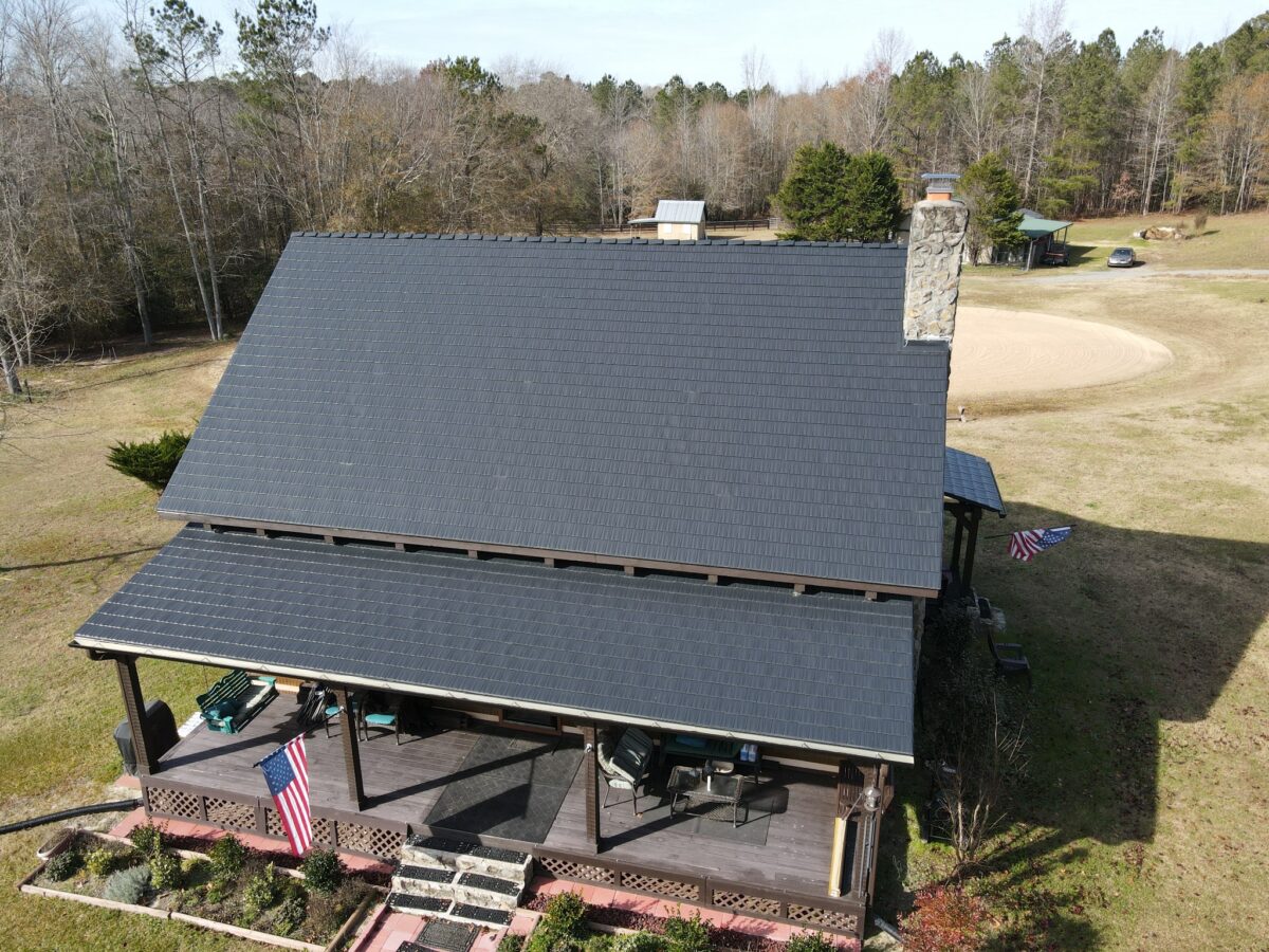 Completed dark Interlock aluminum roof on a North Carolina country home