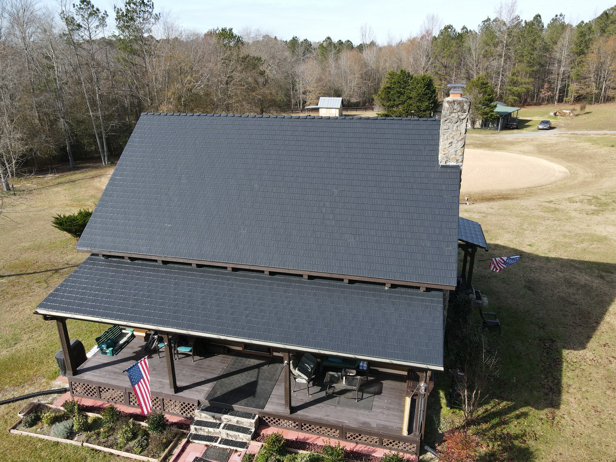 Completed dark Interlock aluminum roof on a North Carolina country home