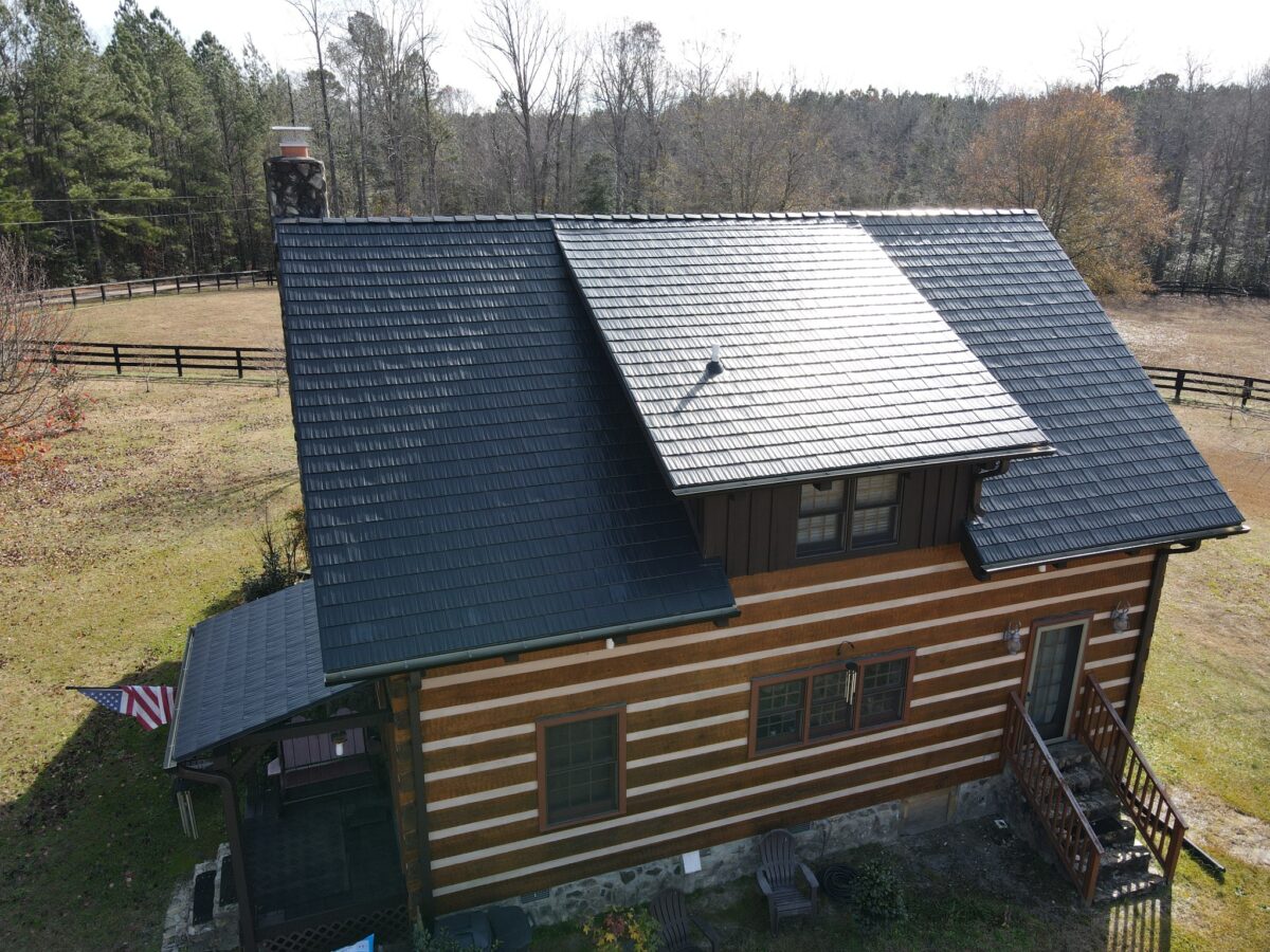 Completed Interlock aluminum roof on a log home