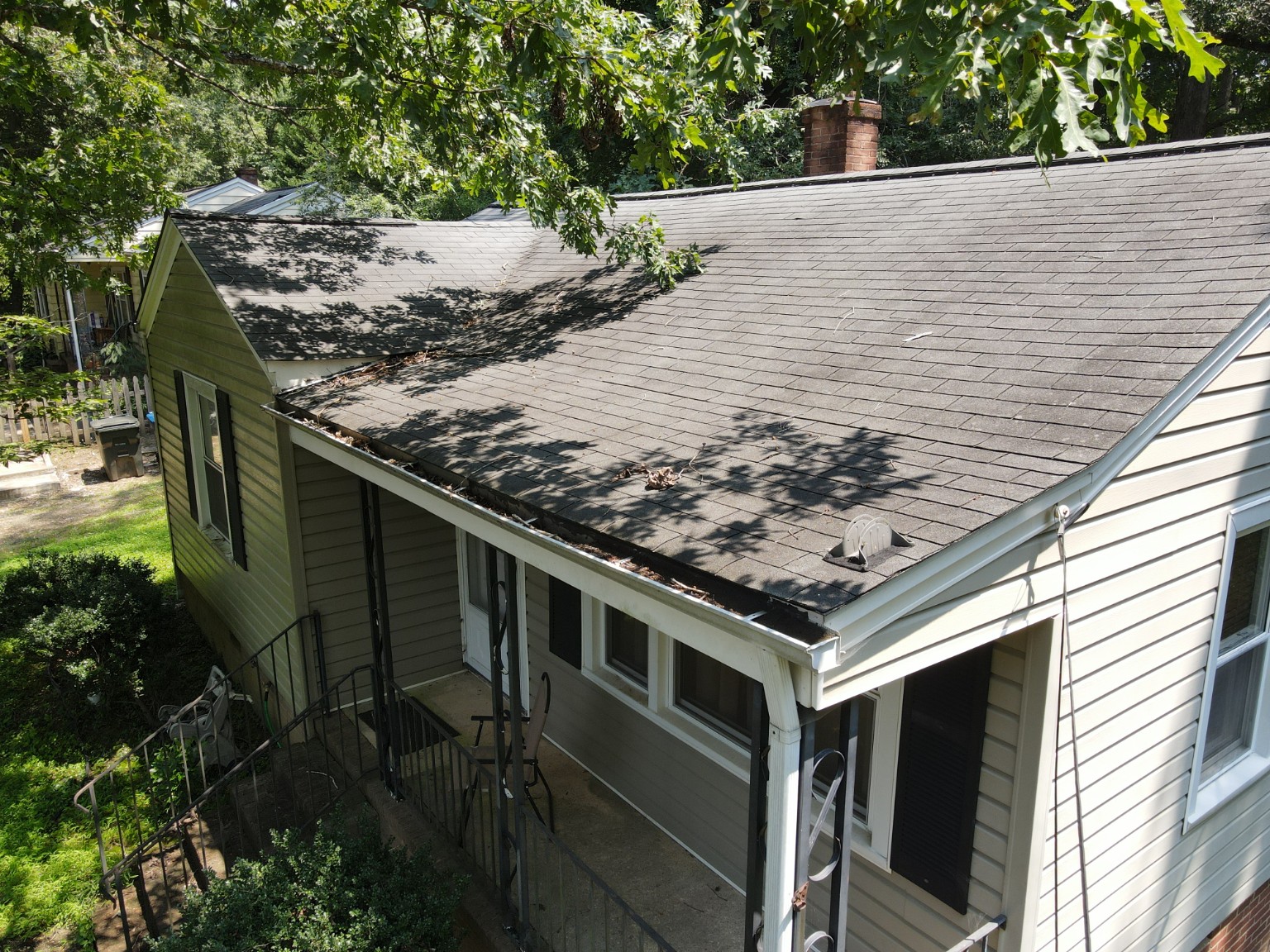 Aging asphalt shingle roof before replacement with Sierra Tan metal roofing in Durham, North Carolina