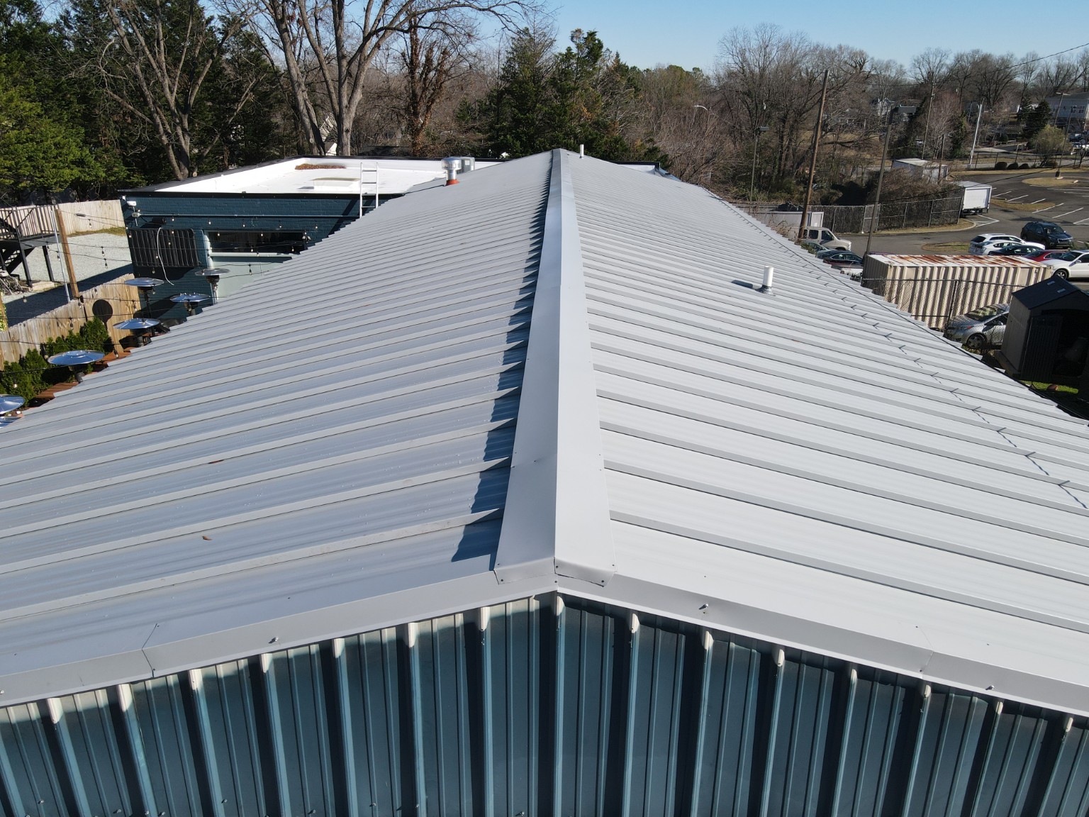 Front aerial view of the standing seam metal roof and ridge at Durham Beer Garden