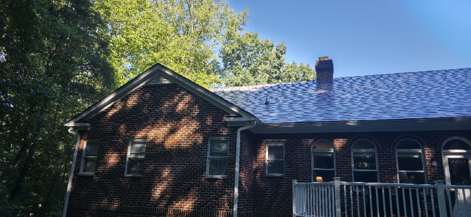 Rear gable and slate-style metal roofing on Chapel Hill brick home