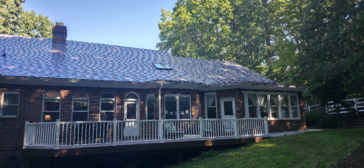 Metal roof above rear porch and sunroom in Chapel Hill NC