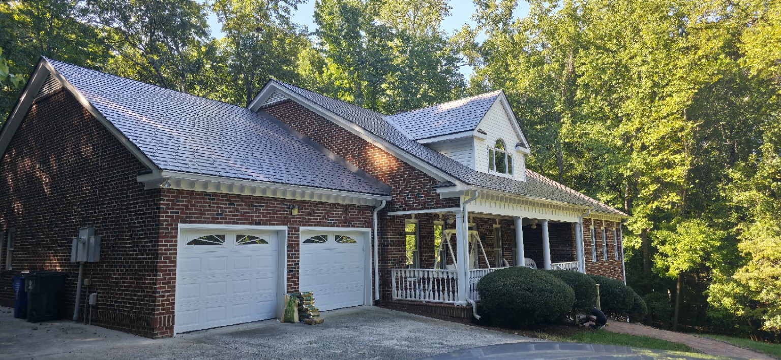 Front and garage view of Chapel Hill Interlock Slate metal roof