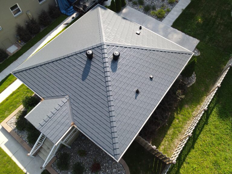 One of two neighboring real Broad Street Durham homes with a completed Deep Charcoal Interlock Slate aluminum roof