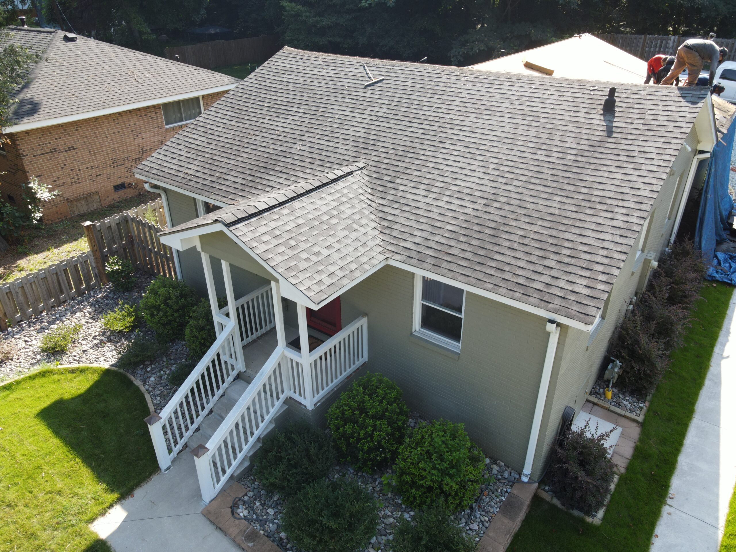 Original drone photo of older asphalt shingles on one Broad Street Durham house before the 2023 metal roof installation